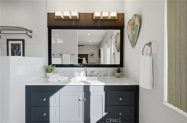 a bathroom with a shower and a sink