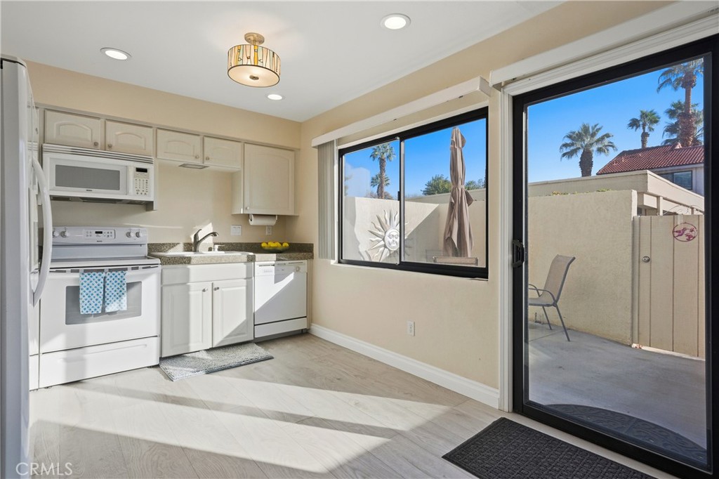 6147 Arroyo Road, Unit 4 Palm Springs, CA 92264 - Photo 9 of 31 View from kitchen to back patio