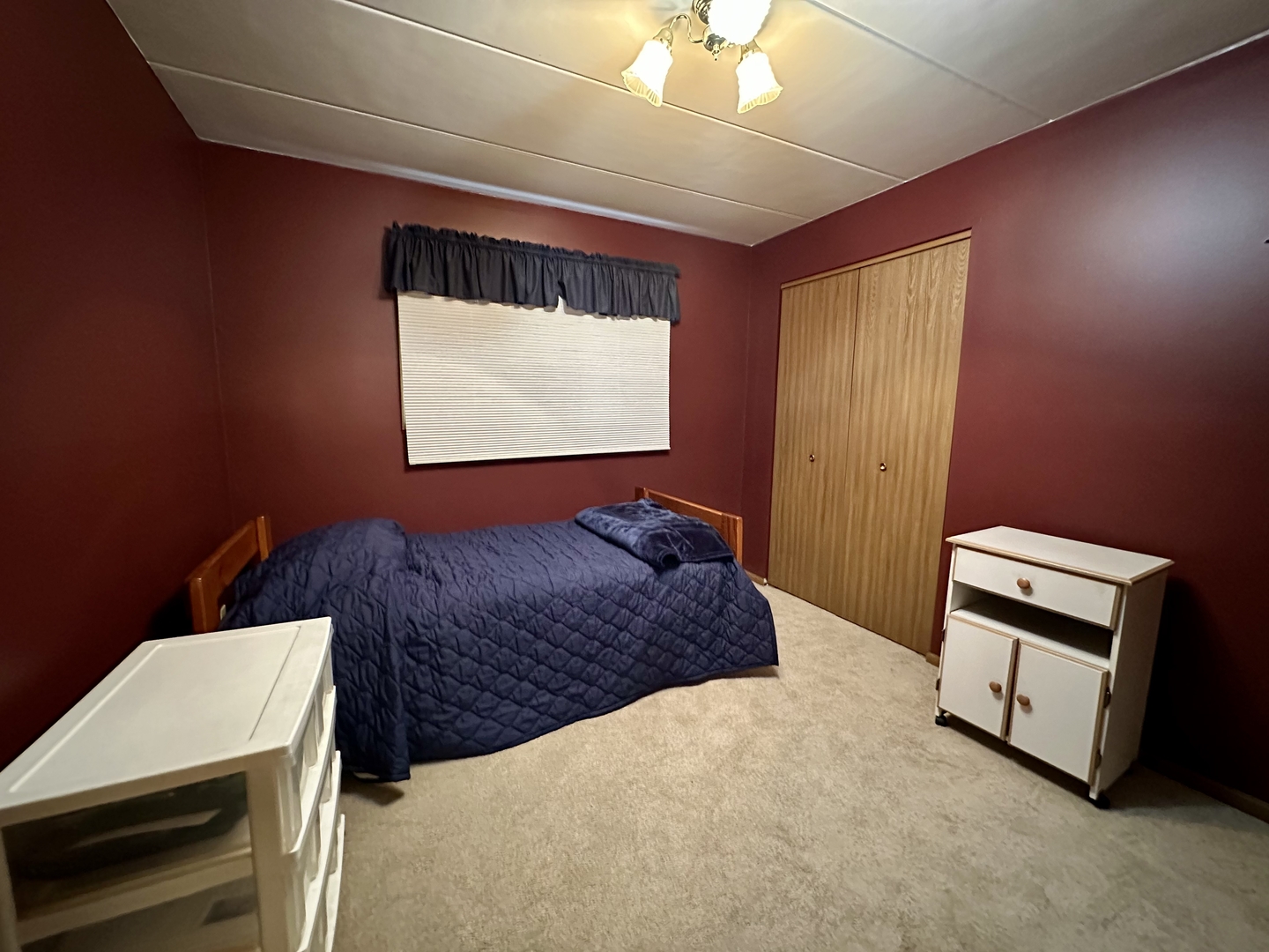 10930 Central Avenue, Unit 1B Chicago Ridge, IL 60415 - Photo 15 of 22 a bedroom with a bed and a night stand