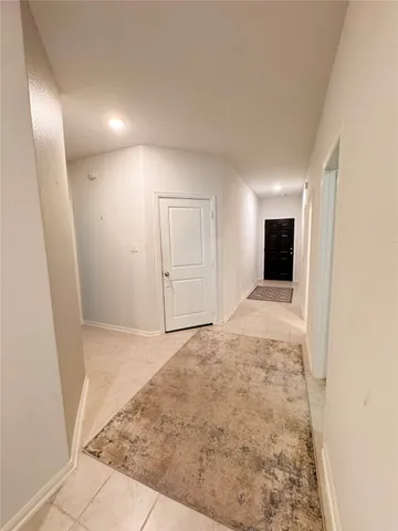 a spacious bedroom with a bed and a couch