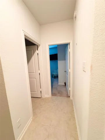 a bedroom with a bed and a television