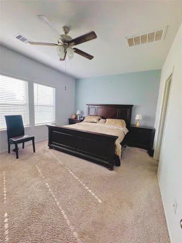 a white toilet sitting next to a shower curtain
