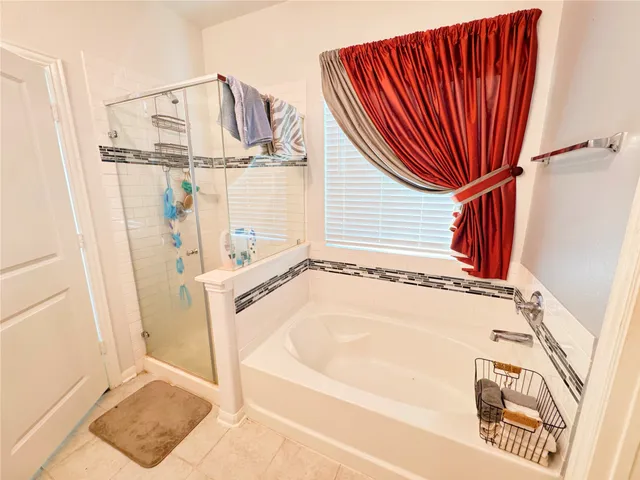 a view of an house with backyard space and balcony