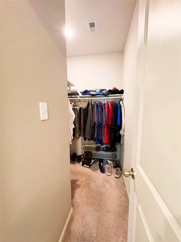a view of a chair and table in backyard of the house
