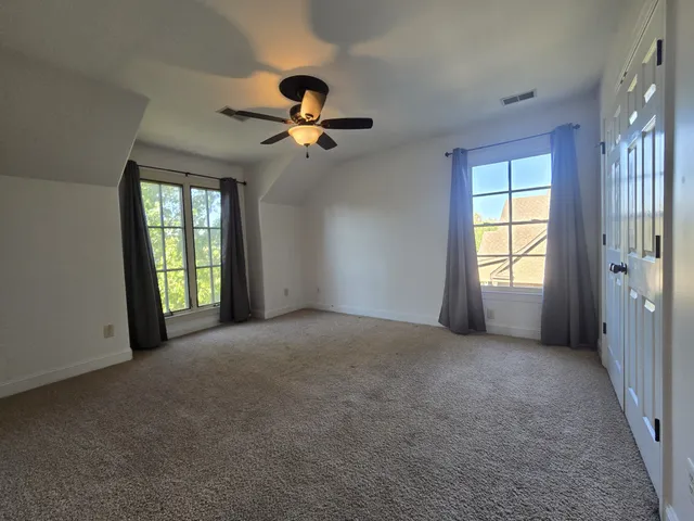 a view of empty room with windows