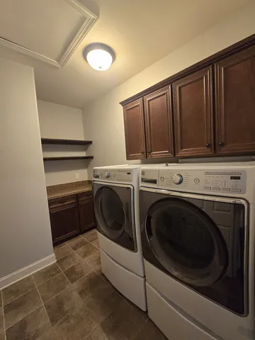 a utility room with dryer and washer