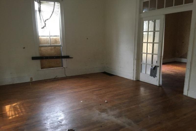 704 Cheatham Street Springfield, TN 37172 - Photo 4 of 7 an empty room with wooden floor and windows