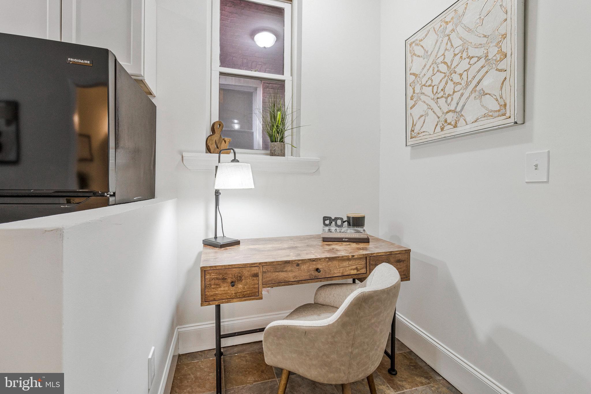1443 East Capitol Street Southeast, Unit 1 Washington, DC 20003 - Photo 11 of 19 a dining room with furniture and wooden floor