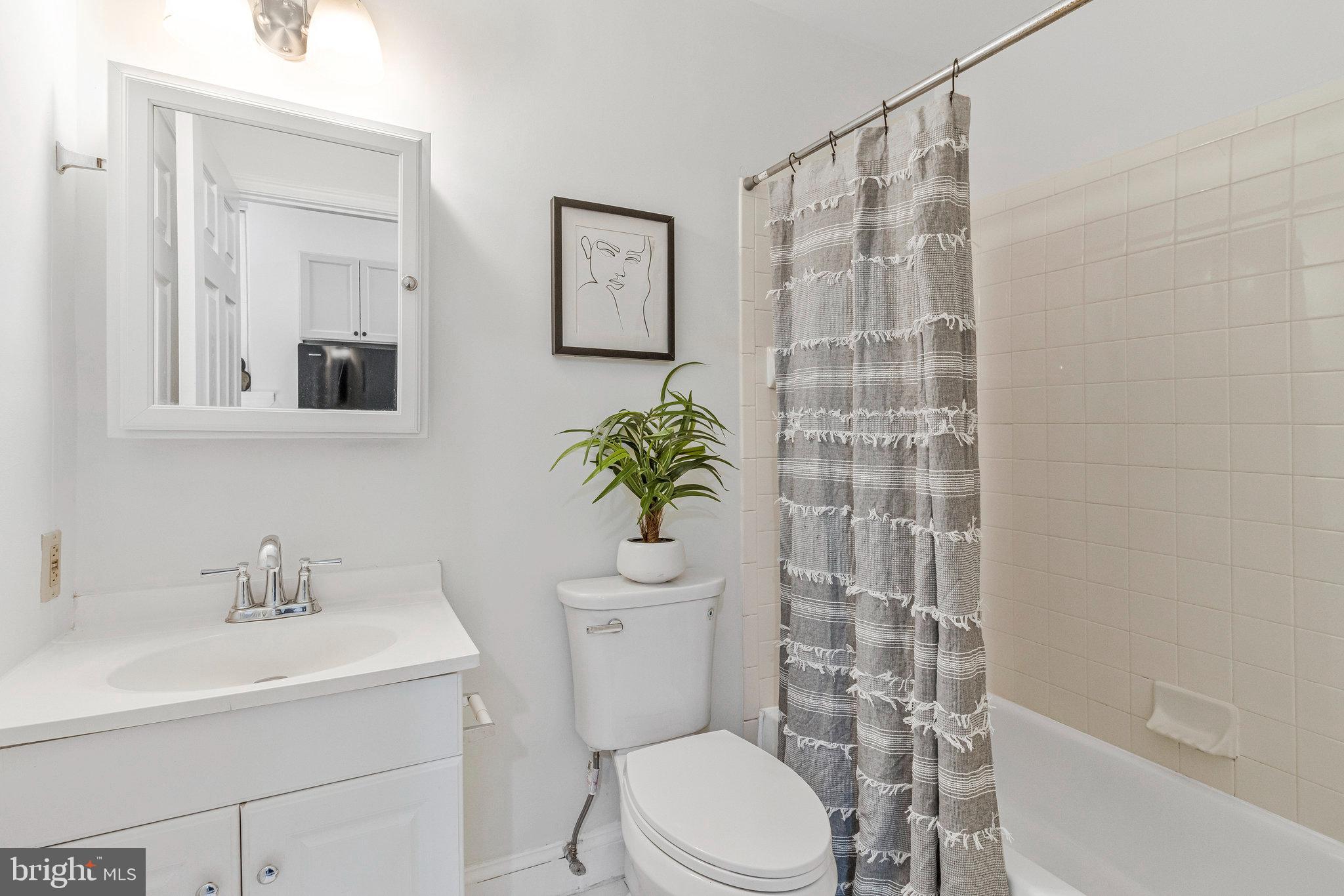 1443 East Capitol Street Southeast, Unit 1 Washington, DC 20003 - Photo 16 of 19 a bathroom with a sink toilet and shower