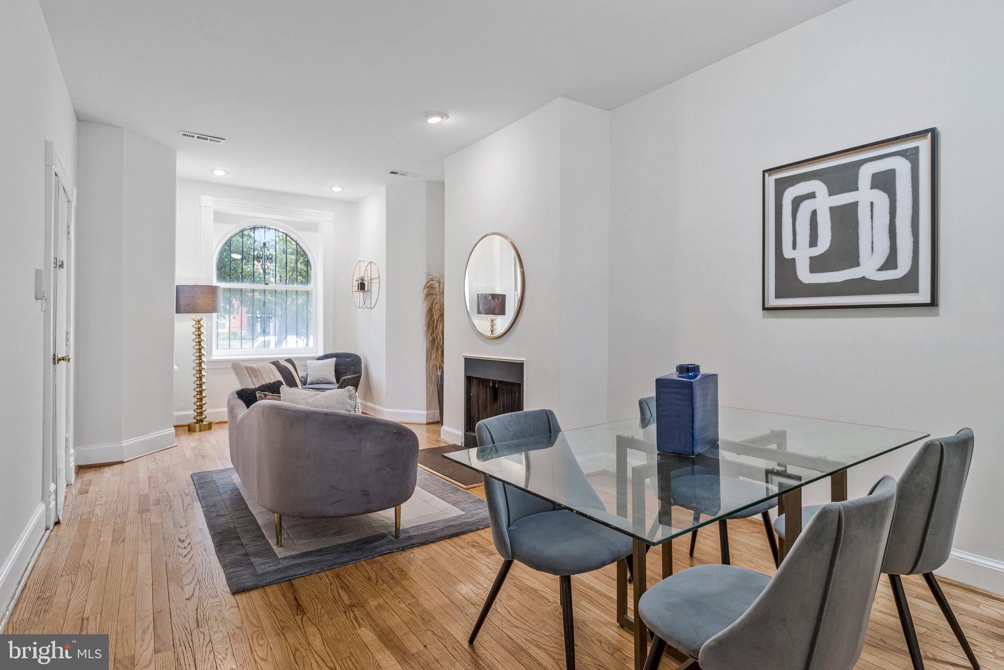 1443 East Capitol Street Southeast, Unit 1 Washington, DC 20003 - Photo 2 of 19 a view of a dining room with furniture window and wooden floor