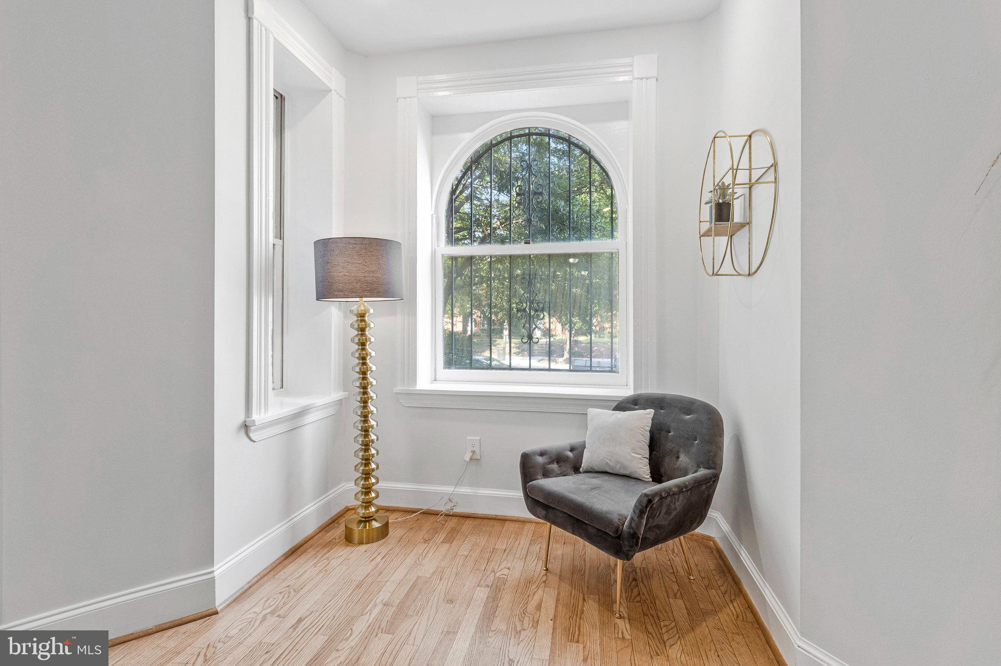 1443 East Capitol Street Southeast, Unit 1 Washington, DC 20003 - Photo 4 of 19 a living room with furniture and a window