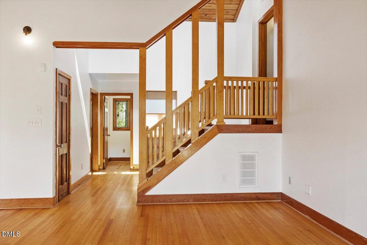 4805 Rembert Drive Raleigh, NC 27612 - Photo 15 of 45 a view of an entryway with wooden floor