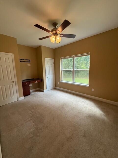 2069 County Highway 83A East Freeport, FL 32439 - Photo 16 of 26 a view of a livingroom with a ceiling fan and window