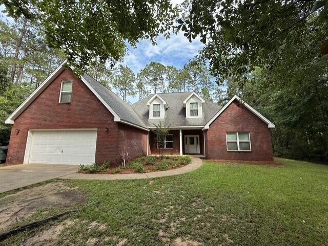 2069 County Highway 83A East Freeport, FL 32439 - Photo 26 of 26 a front view of a house with a yard and garage