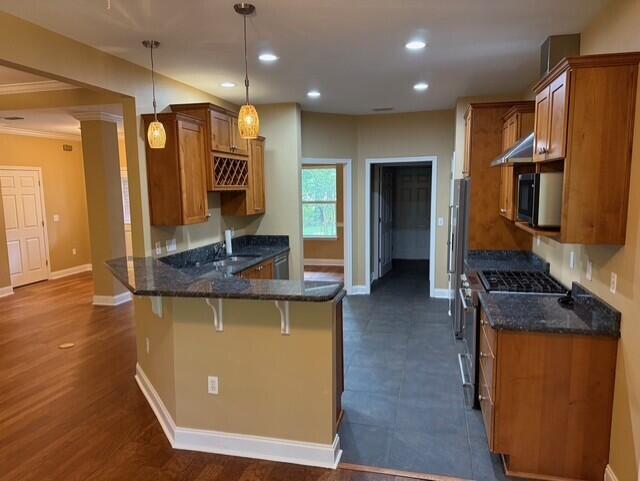 2069 County Highway 83A East Freeport, FL 32439 - Photo 7 of 26 a kitchen with stainless steel appliances granite countertop wooden cabinets and sink