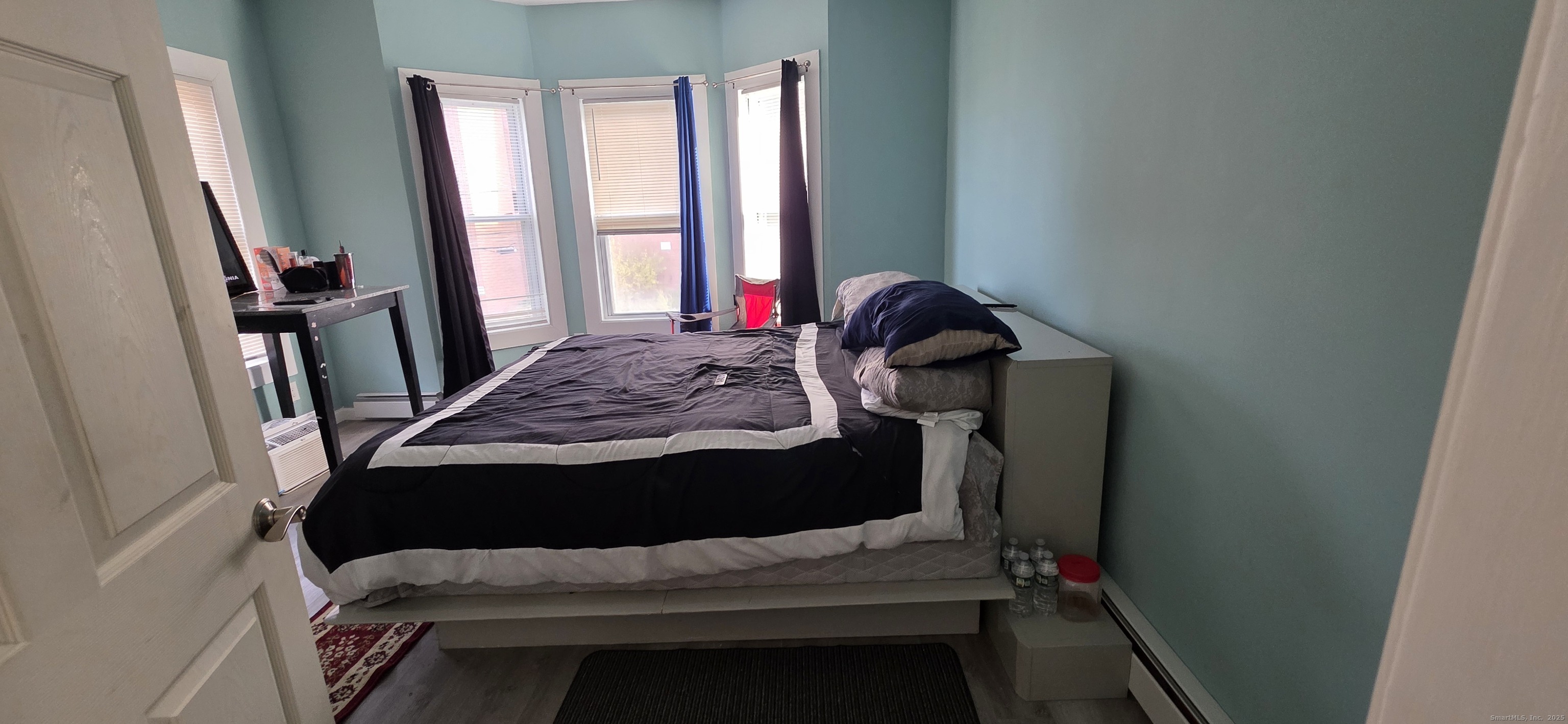 47 Williams Street Hartford, CT 06120 - Photo 14 of 18 a bedroom with a bed and a window