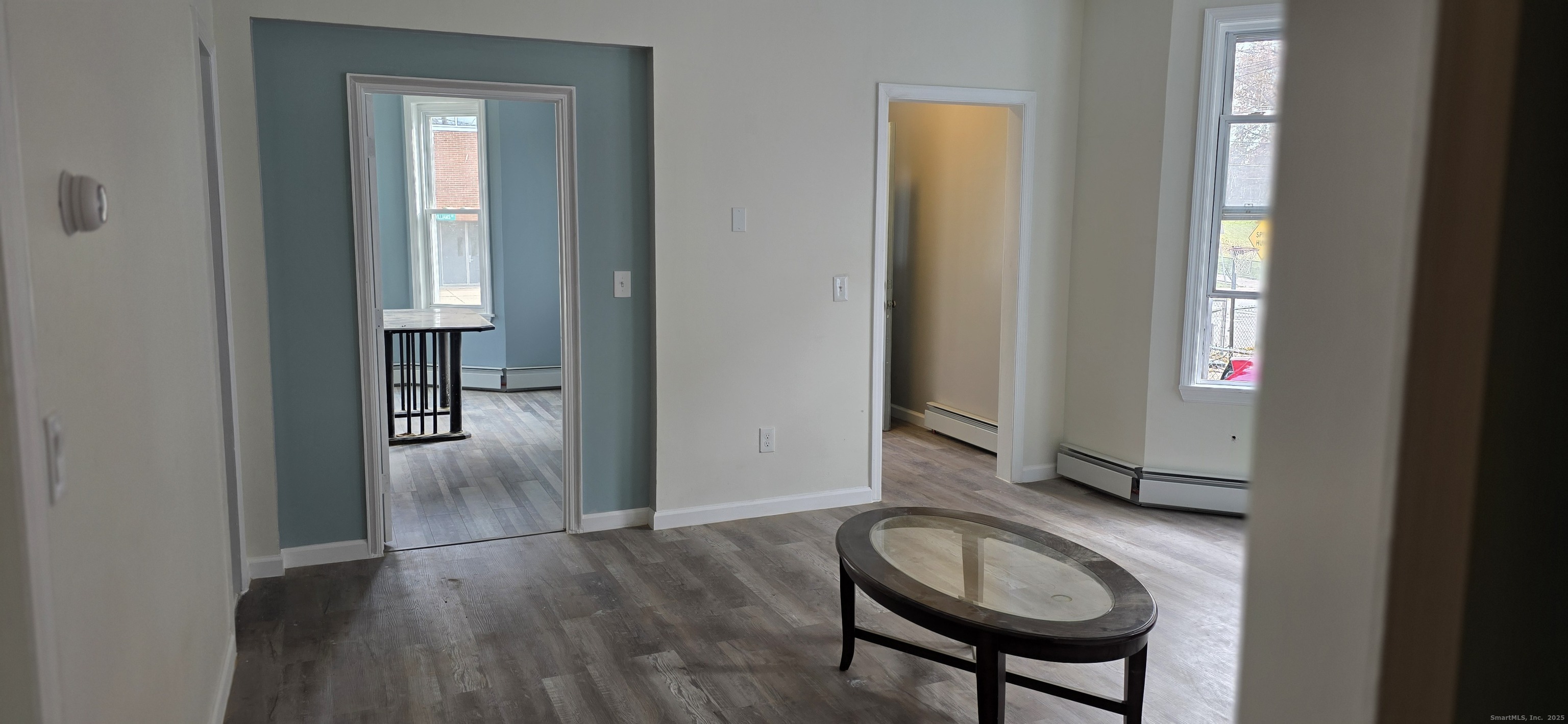 47 Williams Street Hartford, CT 06120 - Photo 3 of 18 a view of a livingroom with furniture and wooden floor