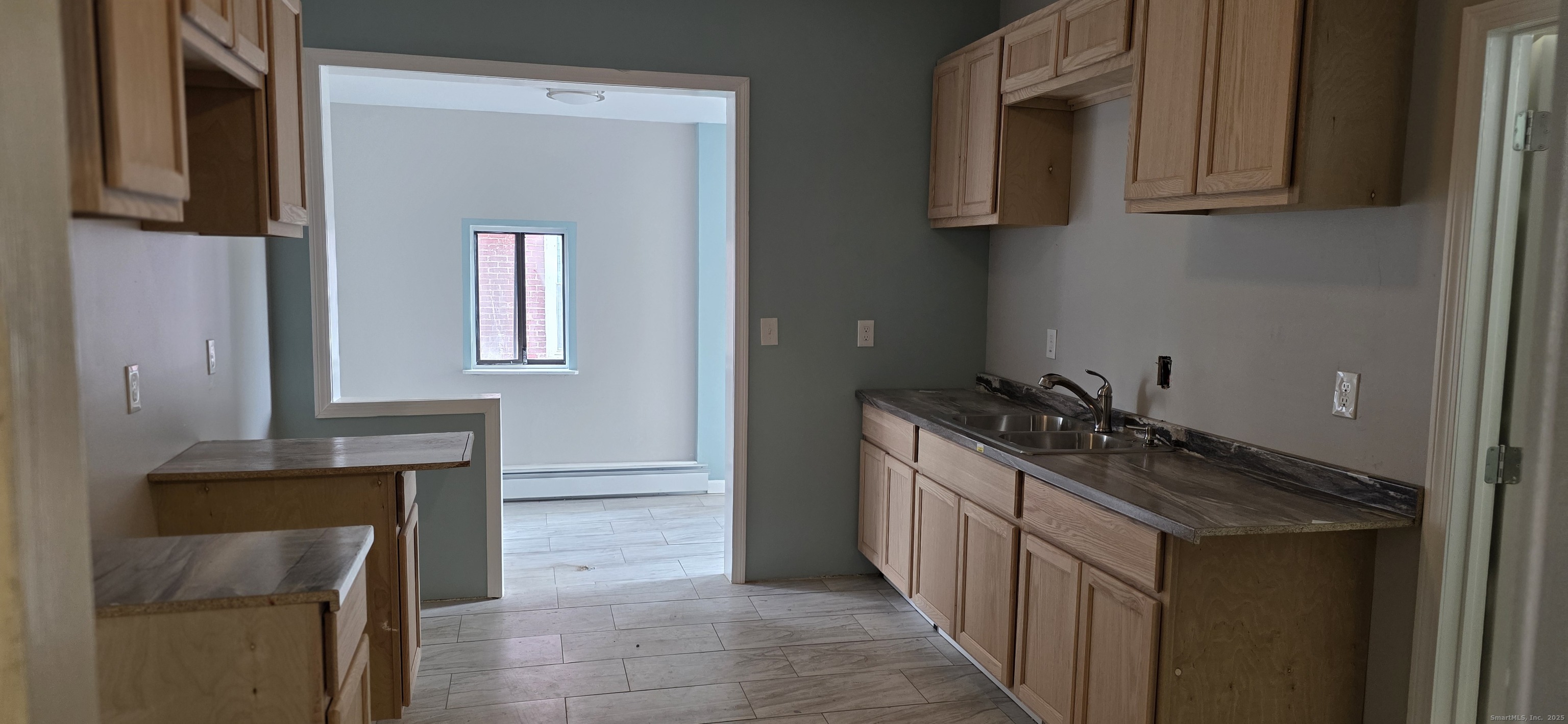 47 Williams Street Hartford, CT 06120 - Photo 8 of 18 a kitchen with a sink and a stove
