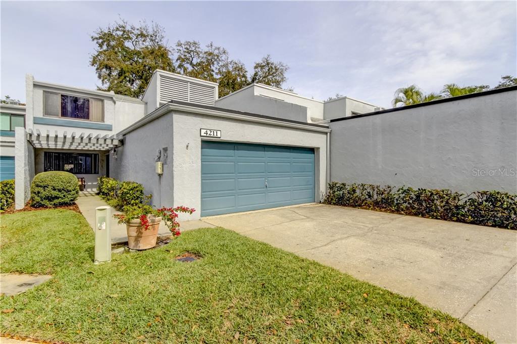 4211 Fairway Run Tampa, FL 33618 - Photo 1 of 1 a front view of a house with a yard and garage