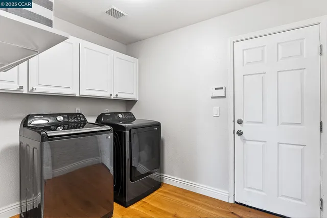 a kitchen with granite countertop a sink and cabinets