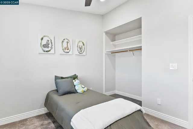 a bedroom with a bed and a table