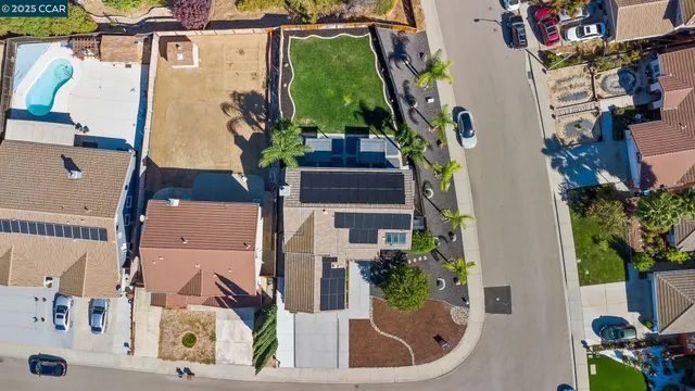 an aerial view of residential houses with outdoor space