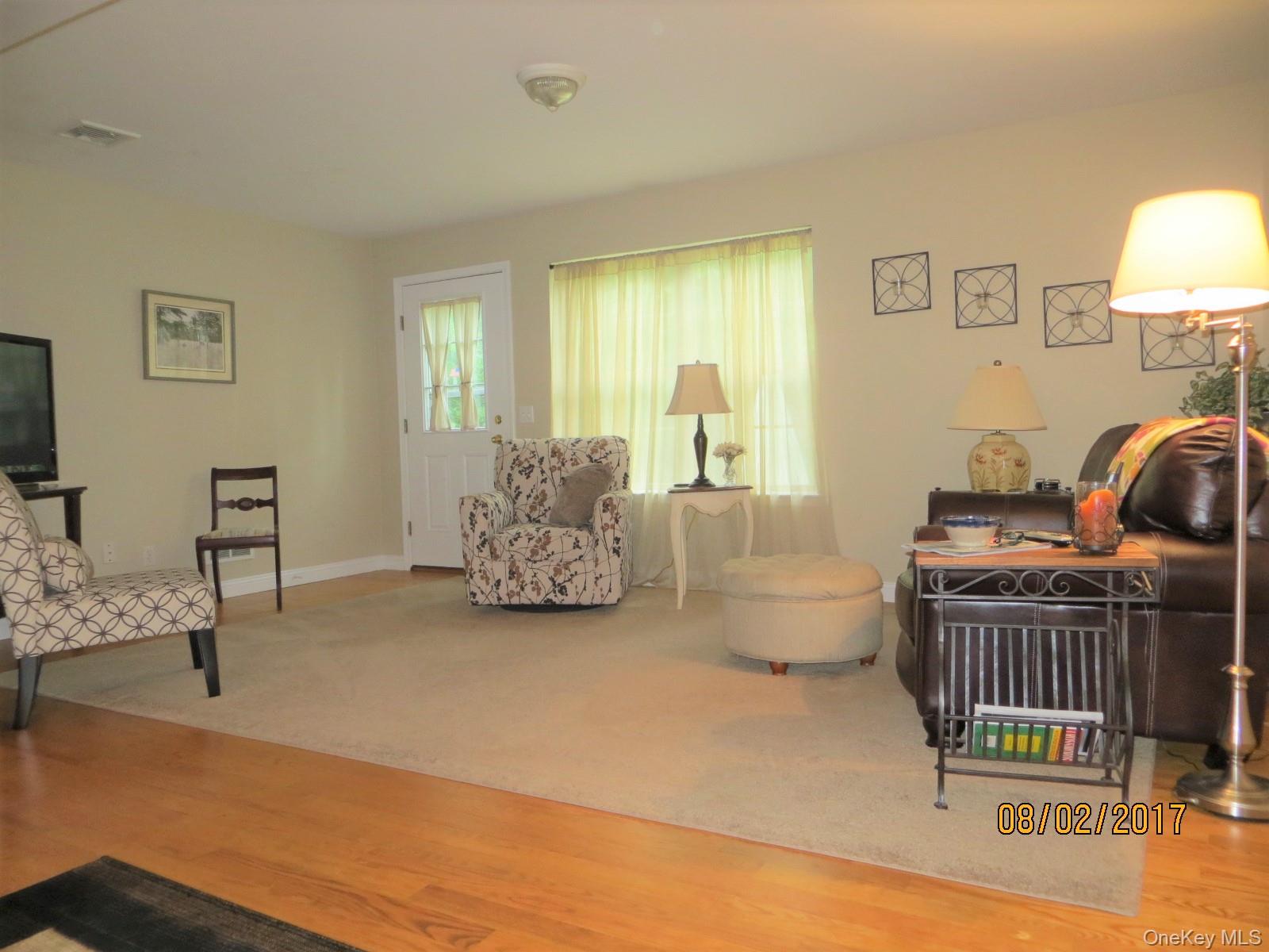 215 Rabbit Run Road Plattekill, NY 12515 - Photo 5 of 14 a living room with furniture and a lamp