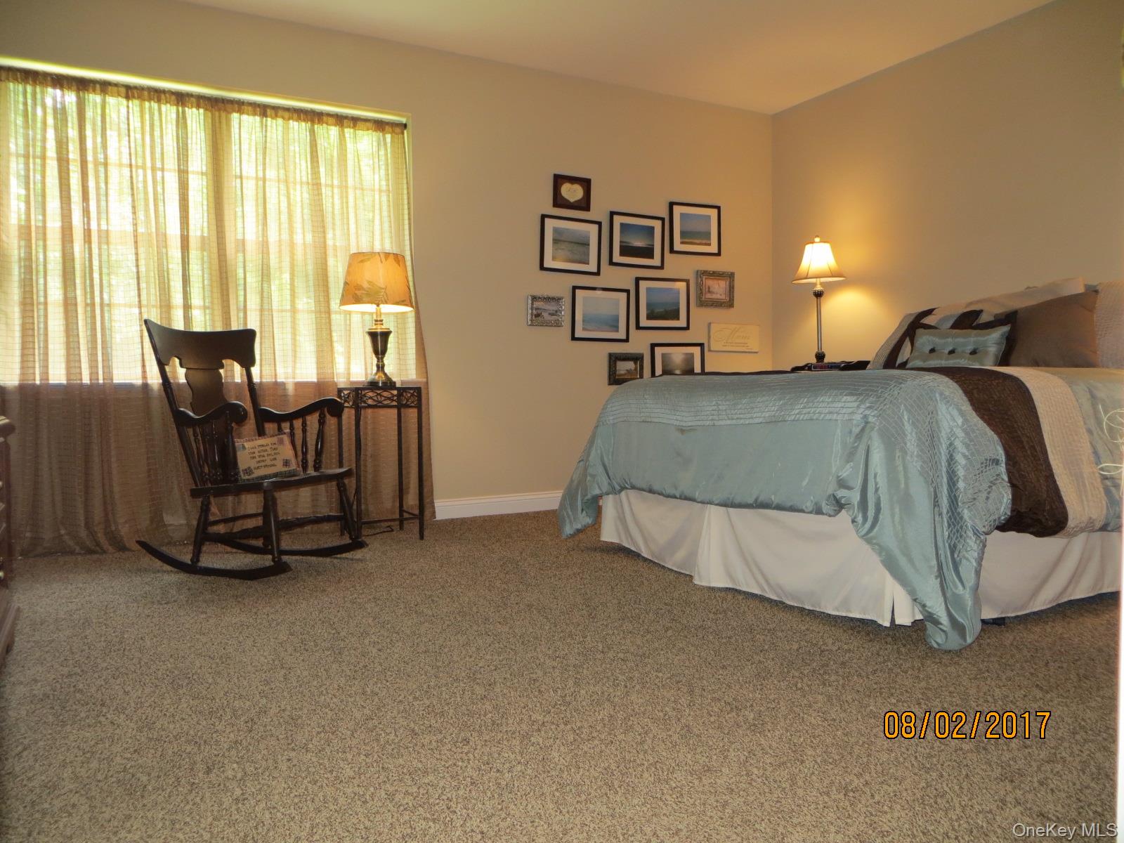 215 Rabbit Run Road Plattekill, NY 12515 - Photo 7 of 14 a bedroom with a bed and chair