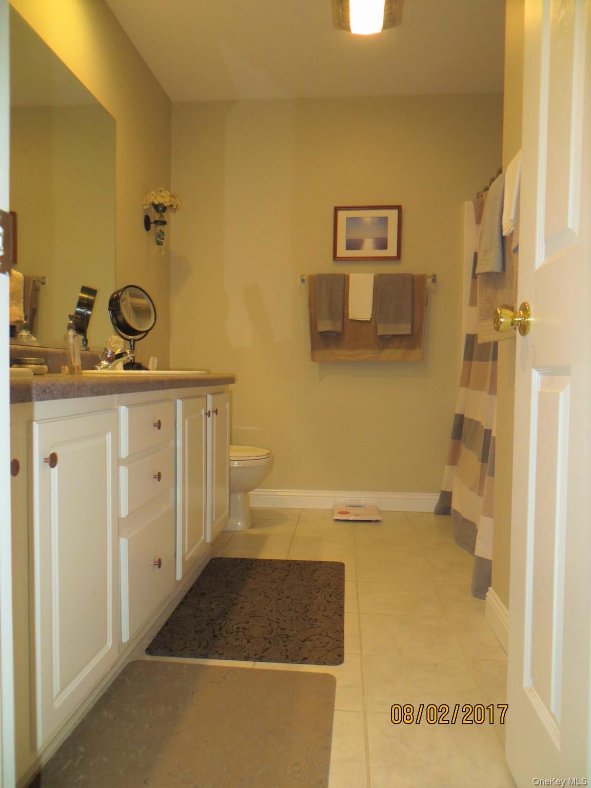 215 Rabbit Run Road Plattekill, NY 12515 - Photo 8 of 14 a bathroom with a granite countertop sink a toilet and shower
