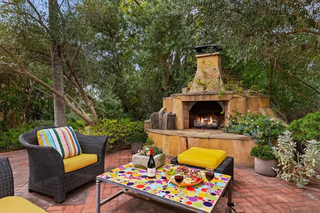 a front view of a house with outdoor seating