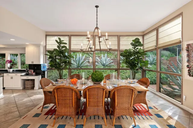 a view of a dining room with furniture window and outside view