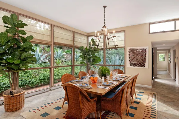 a kitchen with stainless steel appliances granite countertop sink stove and white cabinets