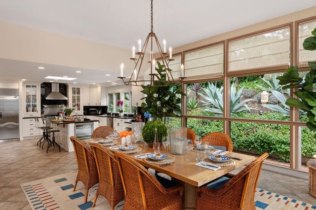 a kitchen with a table and chairs in it