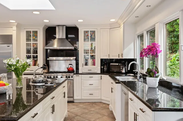 a spacious bedroom with a bed and glass windows