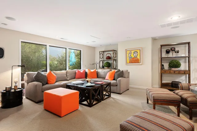 a view of a chairs and table in the back yard of the house
