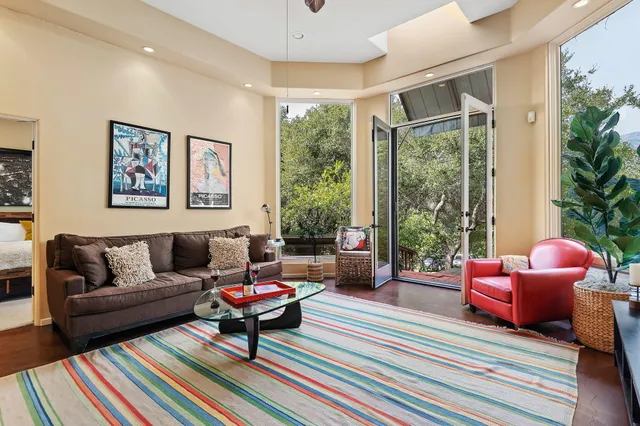 a bedroom with a large bed and a large window