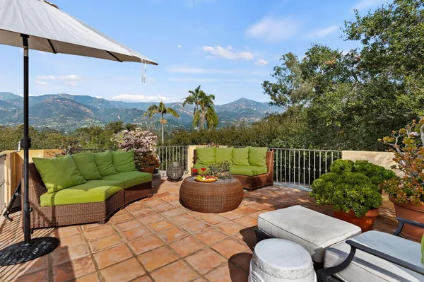 a outdoor living space with furniture and city view