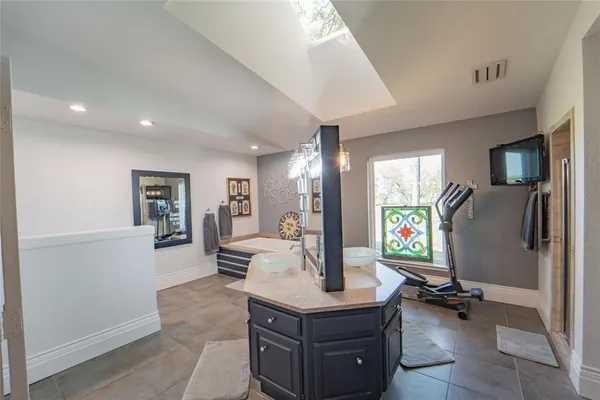a bedroom with bed and a couch