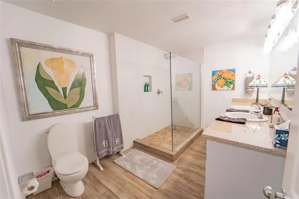 a hallway with furniture and wooden floor