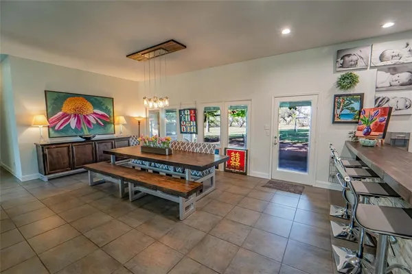 a living room with couches and a potted plant