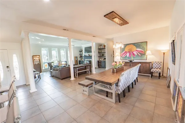 a bedroom with furniture and a flat screen tv