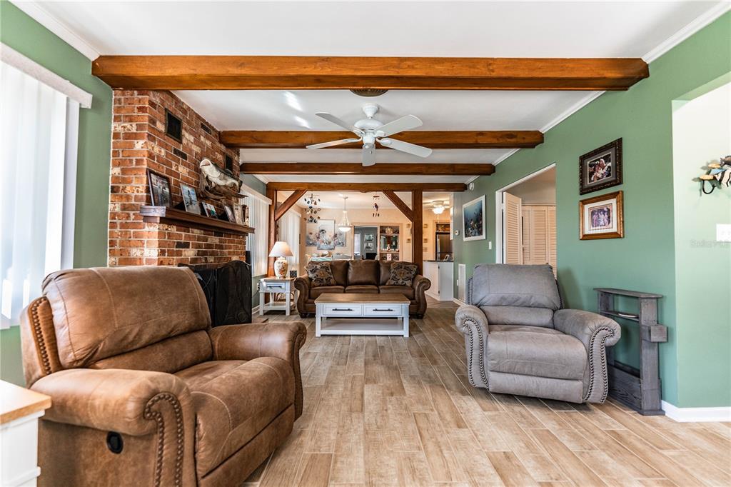 1305 Arbuckle Creek Road Sebring, FL 33870 - Photo 12 of 71 a living room with furniture and a floor to ceiling window