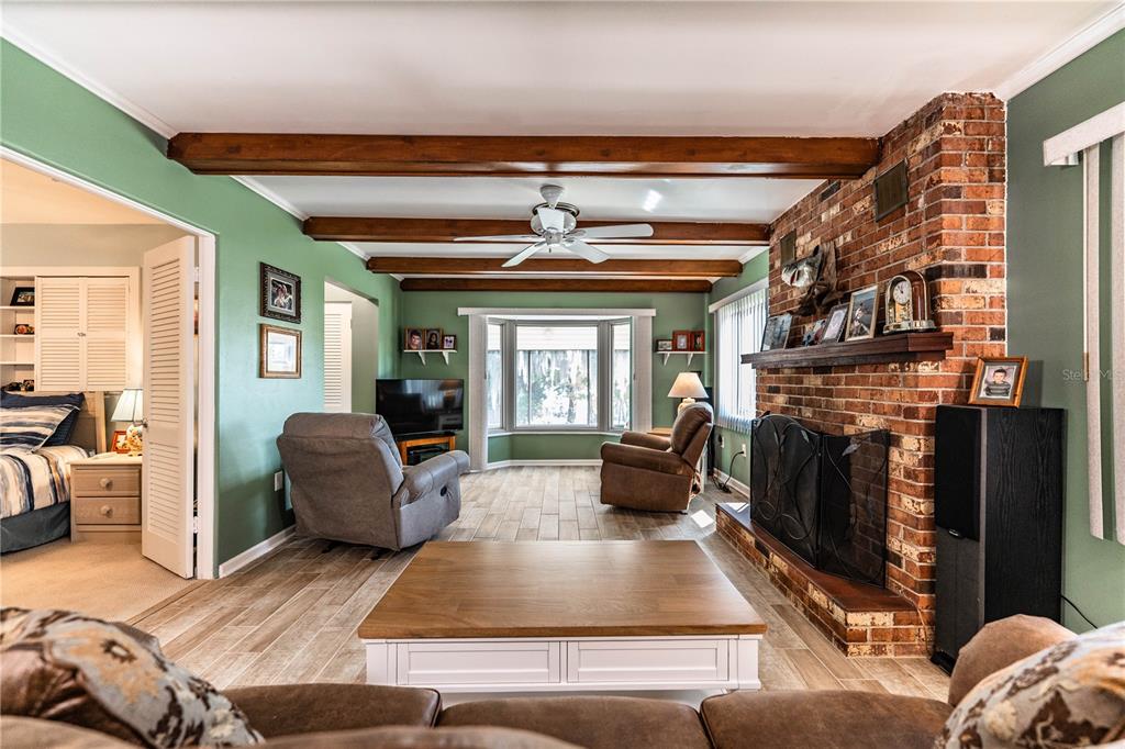 1305 Arbuckle Creek Road Sebring, FL 33870 - Photo 15 of 71 a living room with furniture fireplace and flat screen tv