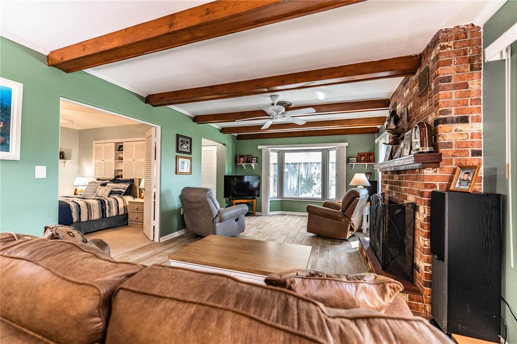 1305 Arbuckle Creek Road Sebring, FL 33870 - Photo 16 of 71 a bedroom with furniture and a large window