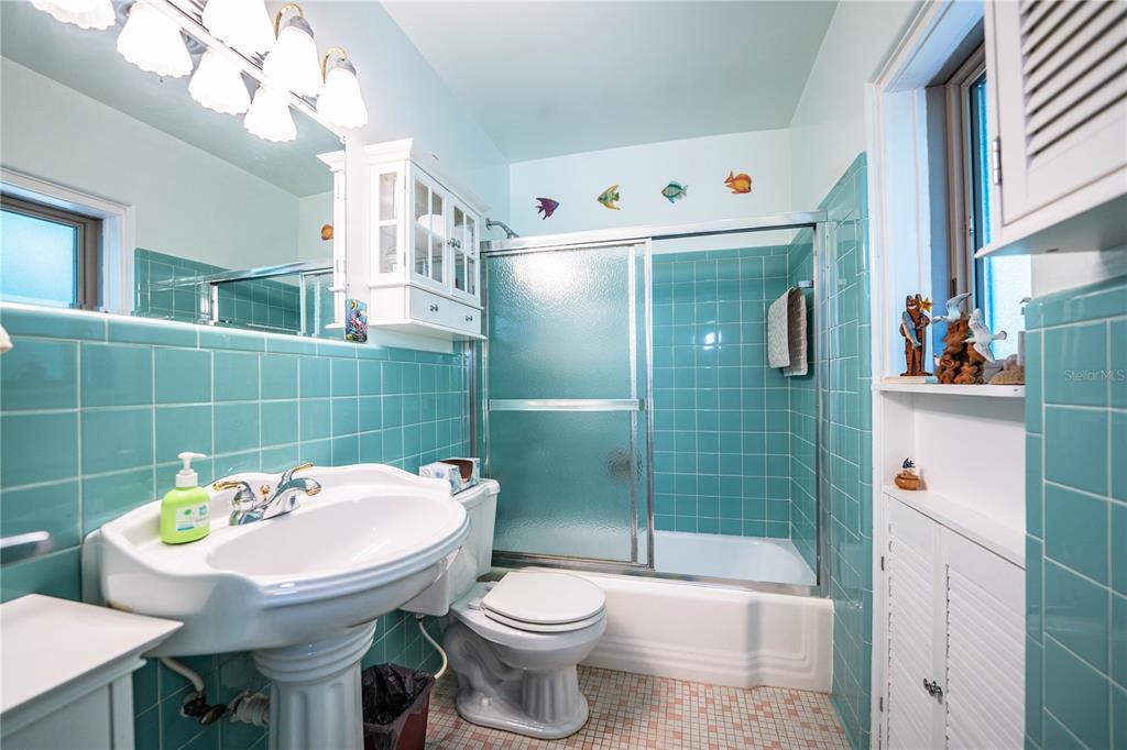 1305 Arbuckle Creek Road Sebring, FL 33870 - Photo 32 of 71 a bathroom with a sink a toilet and shower