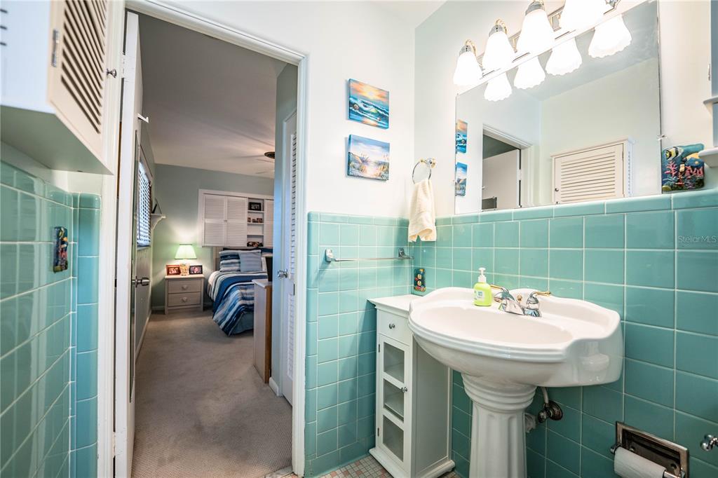 1305 Arbuckle Creek Road Sebring, FL 33870 - Photo 34 of 71 a bathroom with a sink a mirror and a shower