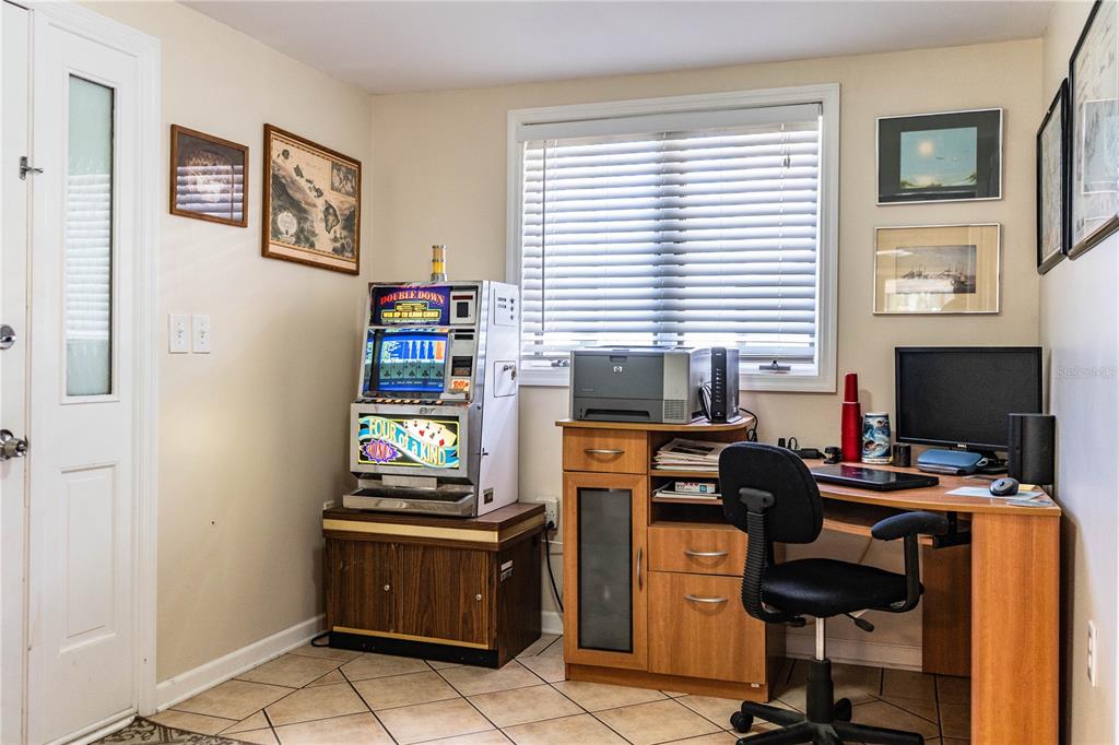1305 Arbuckle Creek Road Sebring, FL 33870 - Photo 35 of 71 a view of a workspace with furniture and a window