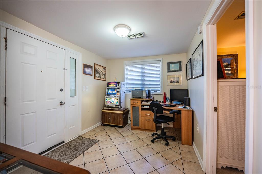 1305 Arbuckle Creek Road Sebring, FL 33870 - Photo 36 of 71 a view of a workspace with furniture and a window