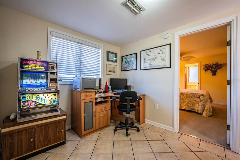 1305 Arbuckle Creek Road Sebring, FL 33870 - Photo 37 of 71 a view of a workspace with furniture and a window