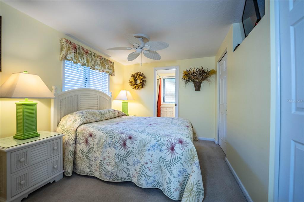 1305 Arbuckle Creek Road Sebring, FL 33870 - Photo 38 of 71 a bedroom with a bed and a chandelier